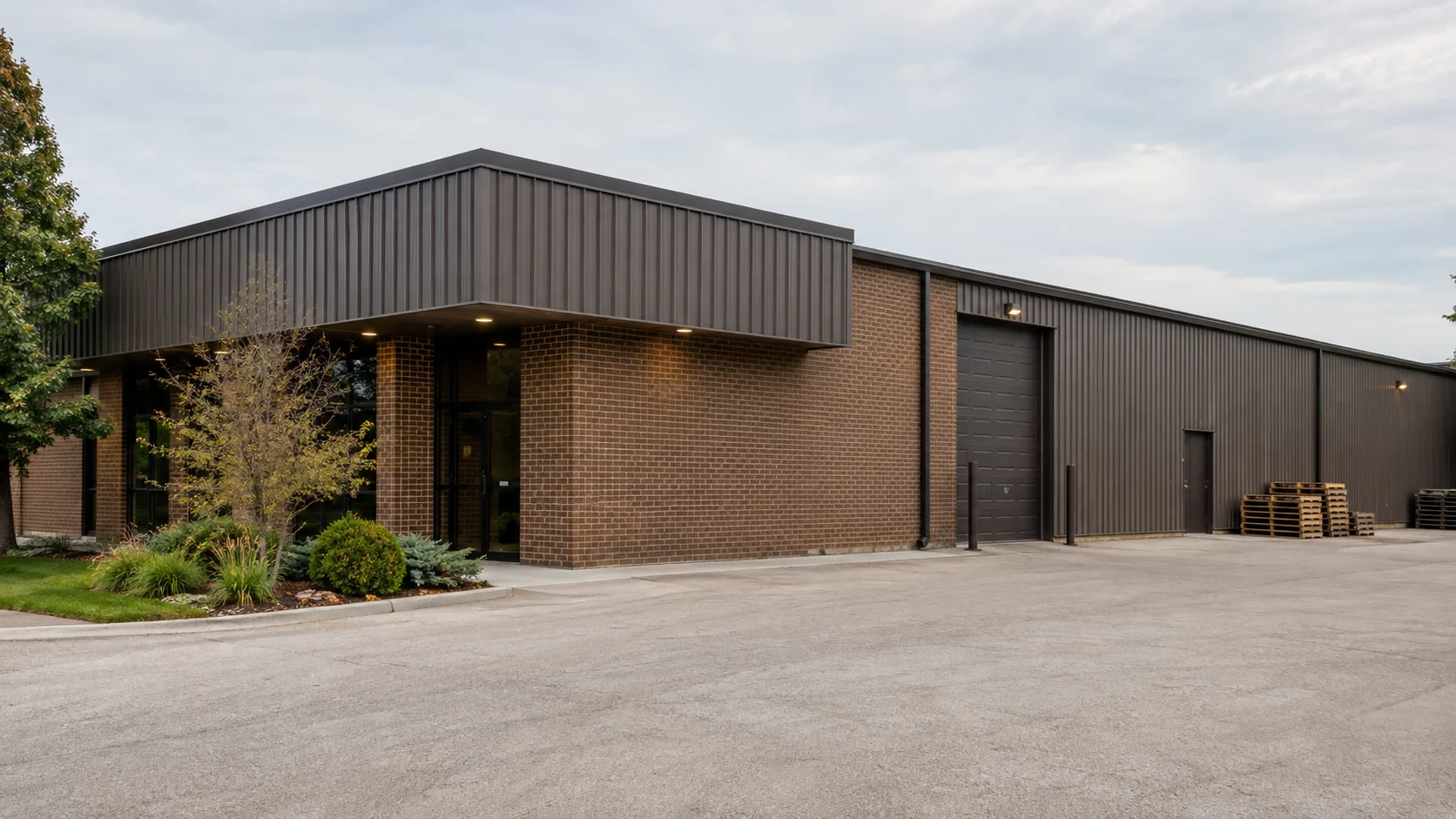 Commercial warehouse with office frontage and shipping pallets