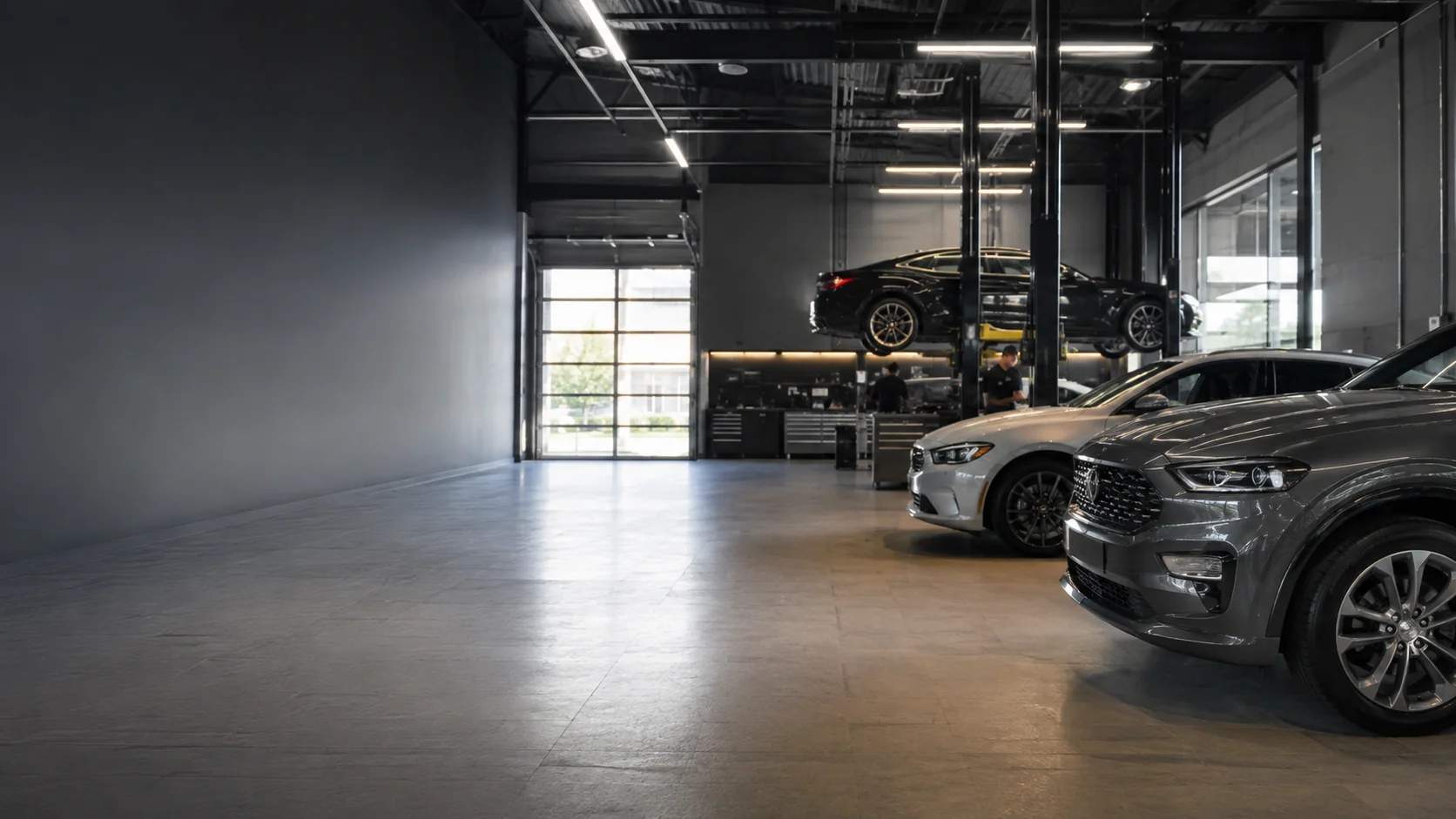 Modern automotive service garage with vehicles on lifts