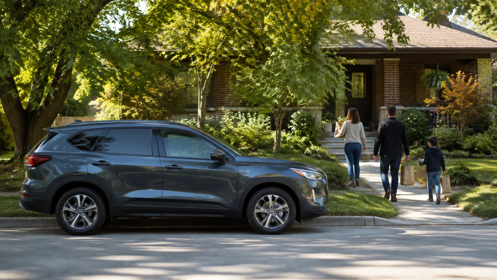 Family walking from their car toward their suburban home with groceries